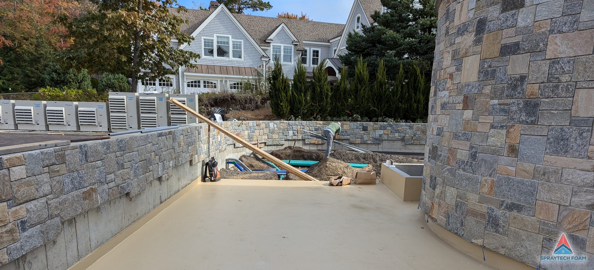 Polyurea-coated stone terrace on a residential project, applied by Spraytech Foam