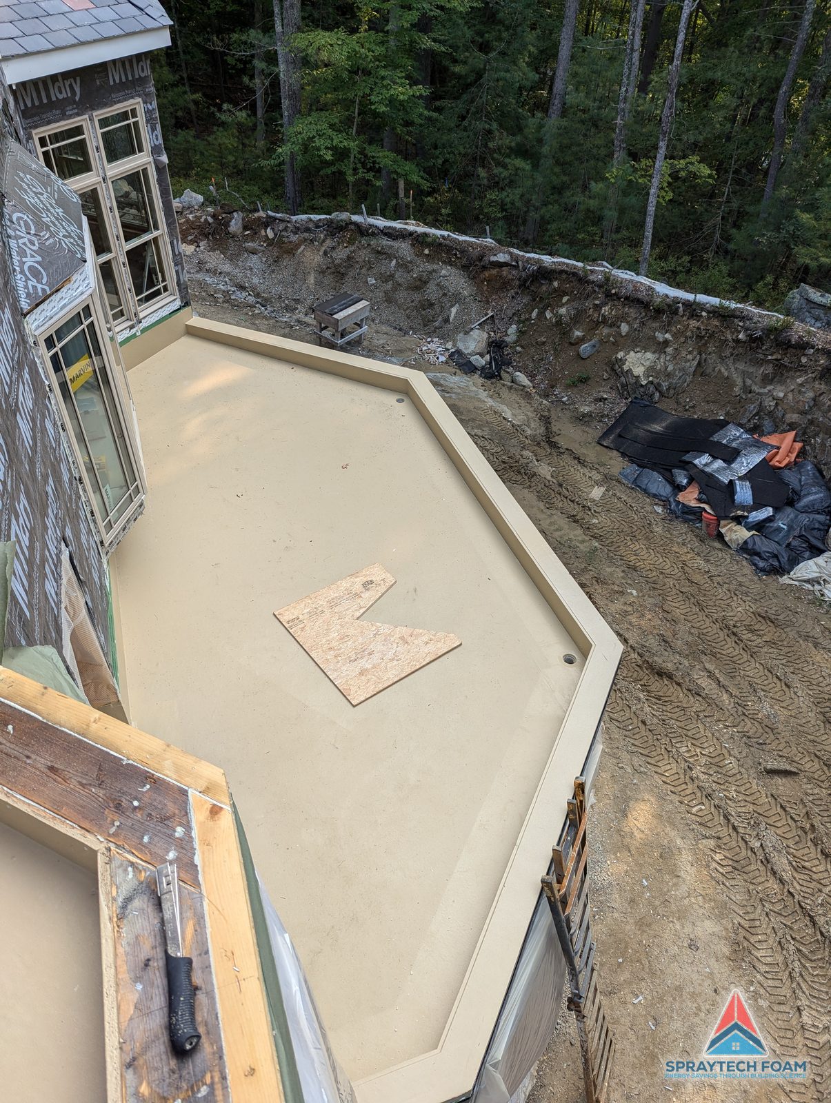 Polyurea-coated deck along a stone foundation